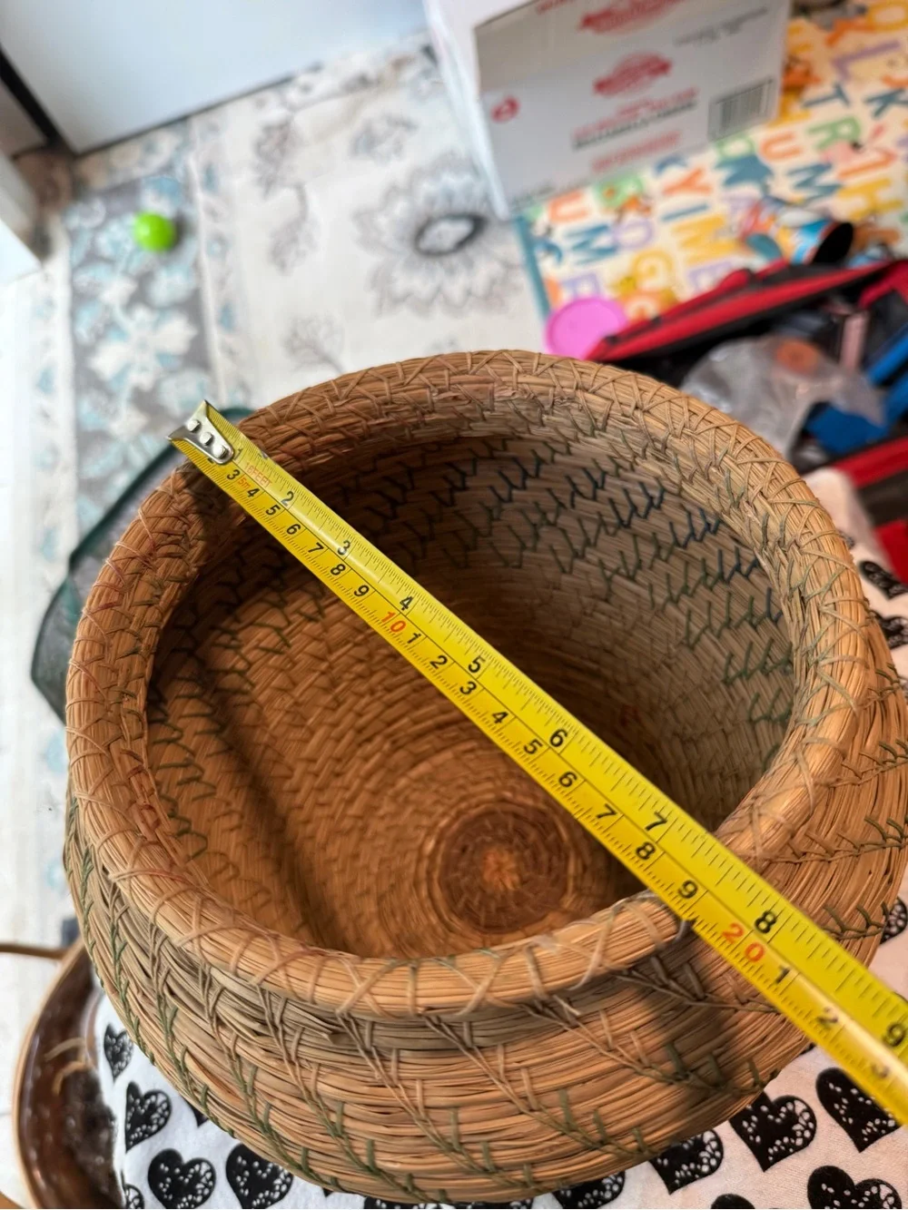 vintage Native American style pine needle basket, similar to those identified